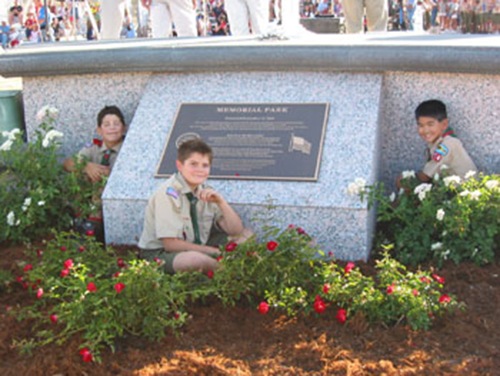 Children next to memorial plaque