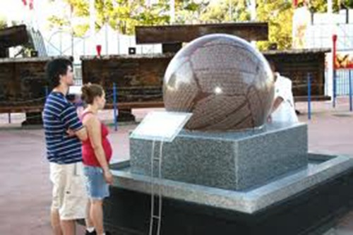 Two people looking at the memorial